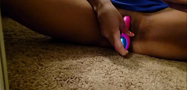  Mixed teen plays with toy.